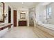 Lavish bathroom with walk-in shower, soaking tub and vanity at 3863 Glasgow Green Dr, Las Vegas, NV 89141