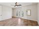 Empty bedroom with neutral tones and tiled flooring with french doors at 3863 Glasgow Green Dr, Las Vegas, NV 89141