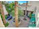 Scenic courtyard featuring decorative lighting, palm trees, and outdoor seating areas for entertaining at 3863 Glasgow Green Dr, Las Vegas, NV 89141