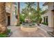 Beautiful courtyard featuring mature trees and landscaping that creates an inviting outdoor living space at 3863 Glasgow Green Dr, Las Vegas, NV 89141