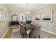 Dining room showcasing wallpaper, crystal chandelier and modern furnishings at 3863 Glasgow Green Dr, Las Vegas, NV 89141