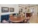 Cozy dining room with wood table and view into the kitchen at 3863 Glasgow Green Dr, Las Vegas, NV 89141