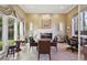 Formal dining room with fireplace, large windows, and custom window treatments at 3863 Glasgow Green Dr, Las Vegas, NV 89141