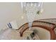 Luxurious foyer featuring a curved staircase, tile floors, and a stunning chandelier at 3863 Glasgow Green Dr, Las Vegas, NV 89141