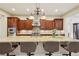 Gourmet kitchen featuring a large island with seating and stainless steel appliances at 3863 Glasgow Green Dr, Las Vegas, NV 89141