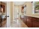 Well-lit mud room with custom cabinetry, granite countertops, and tile flooring at 3863 Glasgow Green Dr, Las Vegas, NV 89141