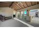 Covered patio with a ceiling fan, ample seating, and views of the well maintained yard at 3863 Glasgow Green Dr, Las Vegas, NV 89141