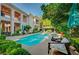 Inviting pool area with comfortable lounge chairs and umbrellas for shaded relaxation at 3863 Glasgow Green Dr, Las Vegas, NV 89141