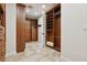 Another view of spacious walk-in closet with custom shelves, drawers, and ample storage space at 3863 Glasgow Green Dr, Las Vegas, NV 89141