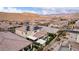 Overhead shot displaying a neighborhood with houses equipped with solar panels and a covered patio area in the backyard at 3929 Reyes Ave, Las Vegas, NV 89141
