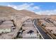 High-angle view of a residential area located next to a natural desert landscape, capturing the neighborhood's setting at 3929 Reyes Ave, Las Vegas, NV 89141