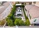 Aerial view of backyard with outdoor kitchen, dining area, putting green, and lounge seating at 3929 Reyes Ave, Las Vegas, NV 89141