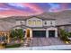 Elegant two-story home with a three-car garage, landscaped front yard, and mountain views at 3929 Reyes Ave, Las Vegas, NV 89141