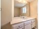 Well-lit bathroom with a large mirror, vanity with storage, and a clean, functional design at 3963 Redwood St, Las Vegas, NV 89103