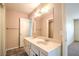Bathroom featuring a double sink vanity, large mirror, and neutral wall colors at 3963 Redwood St, Las Vegas, NV 89103