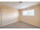 Cozy bedroom featuring carpet flooring and natural light from the window at 3963 Redwood St, Las Vegas, NV 89103