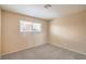 Comfortable bedroom with carpet flooring and window with bright natural light at 3963 Redwood St, Las Vegas, NV 89103