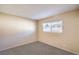 Cozy bedroom with neutral carpet, a window bringing in natural light, and a serene, minimalist aesthetic at 3963 Redwood St, Las Vegas, NV 89103