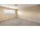 Bright and spacious bedroom with neutral carpet and a large window allowing ample natural light at 3963 Redwood St, Las Vegas, NV 89103