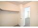Walk-in closet with a single rod and open door to another room at 3963 Redwood St, Las Vegas, NV 89103