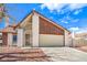 Charming home showcasing a two-car garage, and a gated front entrance, complemented by a well-maintained landscape at 3963 Redwood St, Las Vegas, NV 89103