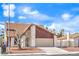 Charming home showcasing a two-car garage, and a gated front entrance, complemented by a well-maintained landscape at 3963 Redwood St, Las Vegas, NV 89103