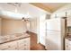 Open kitchen view showcasing countertop space, appliances, wood floors, and a view into an adjacent room at 3963 Redwood St, Las Vegas, NV 89103