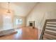 Cozy living room with a brick fireplace, hardwood floors, and ample natural light at 3963 Redwood St, Las Vegas, NV 89103