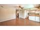 Open-concept living area with hardwood floors, seamlessly connecting to the kitchen and stairs at 3963 Redwood St, Las Vegas, NV 89103