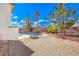 A backyard featuring a refreshing in-ground pool and a rockscaped lounging area at 3963 Redwood St, Las Vegas, NV 89103
