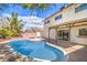 Beautiful backyard pool with surrounding patio, perfect for outdoor entertaining and relaxation at 3963 Redwood St, Las Vegas, NV 89103