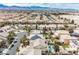 Picturesque aerial view of homes with a pool and manicured lawns at 4208 Lower Saxon Ave, North Las Vegas, NV 89085