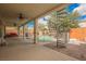 Expansive covered patio overlooks a refreshing pool, complete with a spiral staircase to the upper level at 4208 Lower Saxon Ave, North Las Vegas, NV 89085