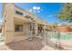 Inviting backyard featuring a private pool, spiral staircase, and covered patio, perfect for outdoor entertaining at 4208 Lower Saxon Ave, North Las Vegas, NV 89085
