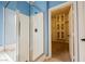 Bathroom with glass shower and walk-in closet at 4208 Lower Saxon Ave, North Las Vegas, NV 89085