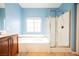 Bright bathroom featuring a soaking tub and glass-enclosed shower at 4208 Lower Saxon Ave, North Las Vegas, NV 89085