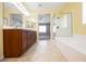 A bathroom featuring a double vanity, a bathtub, a shower, and tile flooring at 4208 Lower Saxon Ave, North Las Vegas, NV 89085
