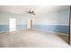 Bright bedroom with neutral carpet and a large window for natural light at 4208 Lower Saxon Ave, North Las Vegas, NV 89085