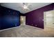 Large bedroom featuring carpet, ceiling fan, starry sky themed walls and closet at 4208 Lower Saxon Ave, North Las Vegas, NV 89085