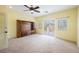 Spacious bedroom featuring a ceiling fan, neutral carpeting, and an attached balcony at 4208 Lower Saxon Ave, North Las Vegas, NV 89085