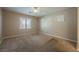 Comfortable bedroom with carpet flooring, ceiling fan, and natural light at 4208 Lower Saxon Ave, North Las Vegas, NV 89085