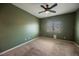Carpeted bedroom featuring a ceiling fan and a window with natural light at 4208 Lower Saxon Ave, North Las Vegas, NV 89085