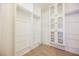 Walk-in closet with built-in shelving and cabinets at 4208 Lower Saxon Ave, North Las Vegas, NV 89085