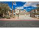 Beautiful two-story home featuring a three-car garage and well-maintained landscaping at 4208 Lower Saxon Ave, North Las Vegas, NV 89085