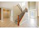 Welcoming foyer with tile flooring, staircase and ample natural light at 4208 Lower Saxon Ave, North Las Vegas, NV 89085