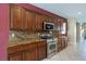 Well-maintained kitchen with stainless steel appliances and granite countertops at 4208 Lower Saxon Ave, North Las Vegas, NV 89085