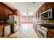 Modern kitchen with stainless steel appliances, granite countertops, and natural light at 4208 Lower Saxon Ave, North Las Vegas, NV 89085