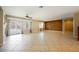 Spacious living room with tile floors and sliding glass doors to the backyard at 4208 Lower Saxon Ave, North Las Vegas, NV 89085
