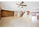 Spacious living room with decorative wall art, tiled floors, and a ceiling fan at 4208 Lower Saxon Ave, North Las Vegas, NV 89085
