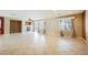 Open living room featuring tile flooring, a fireplace, and large windows at 4208 Lower Saxon Ave, North Las Vegas, NV 89085